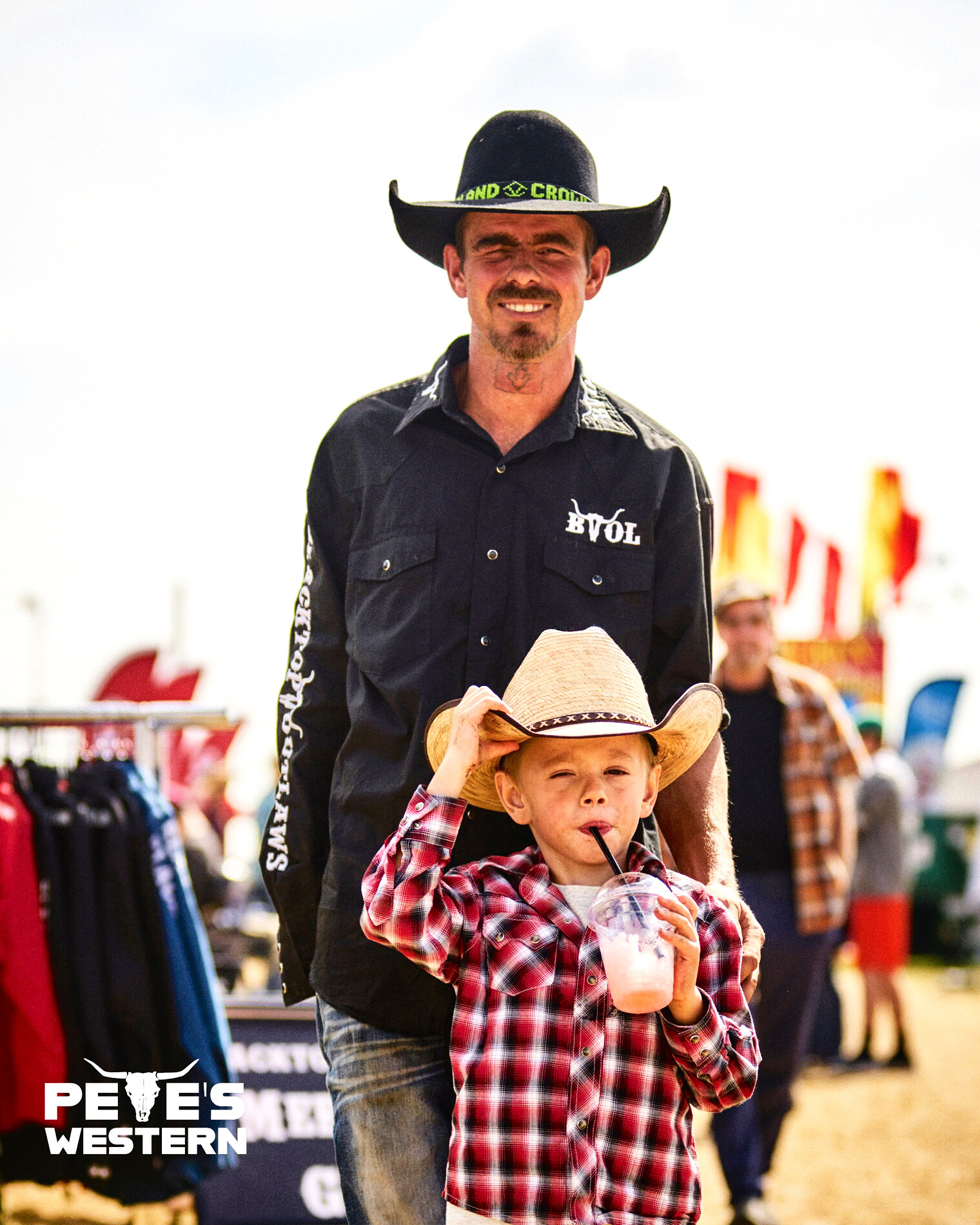 Candid shot of bull rider Curtis Crowley and Crowley Jr. at the Ram Rodeo Tour